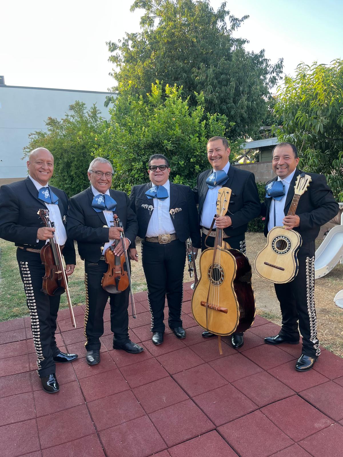 Members of Mariachi Mexicanísimo LA with their instruments in Los Angeles