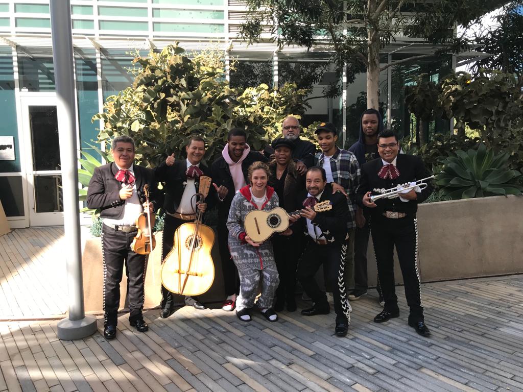Mariachi musicians with guests outdoors