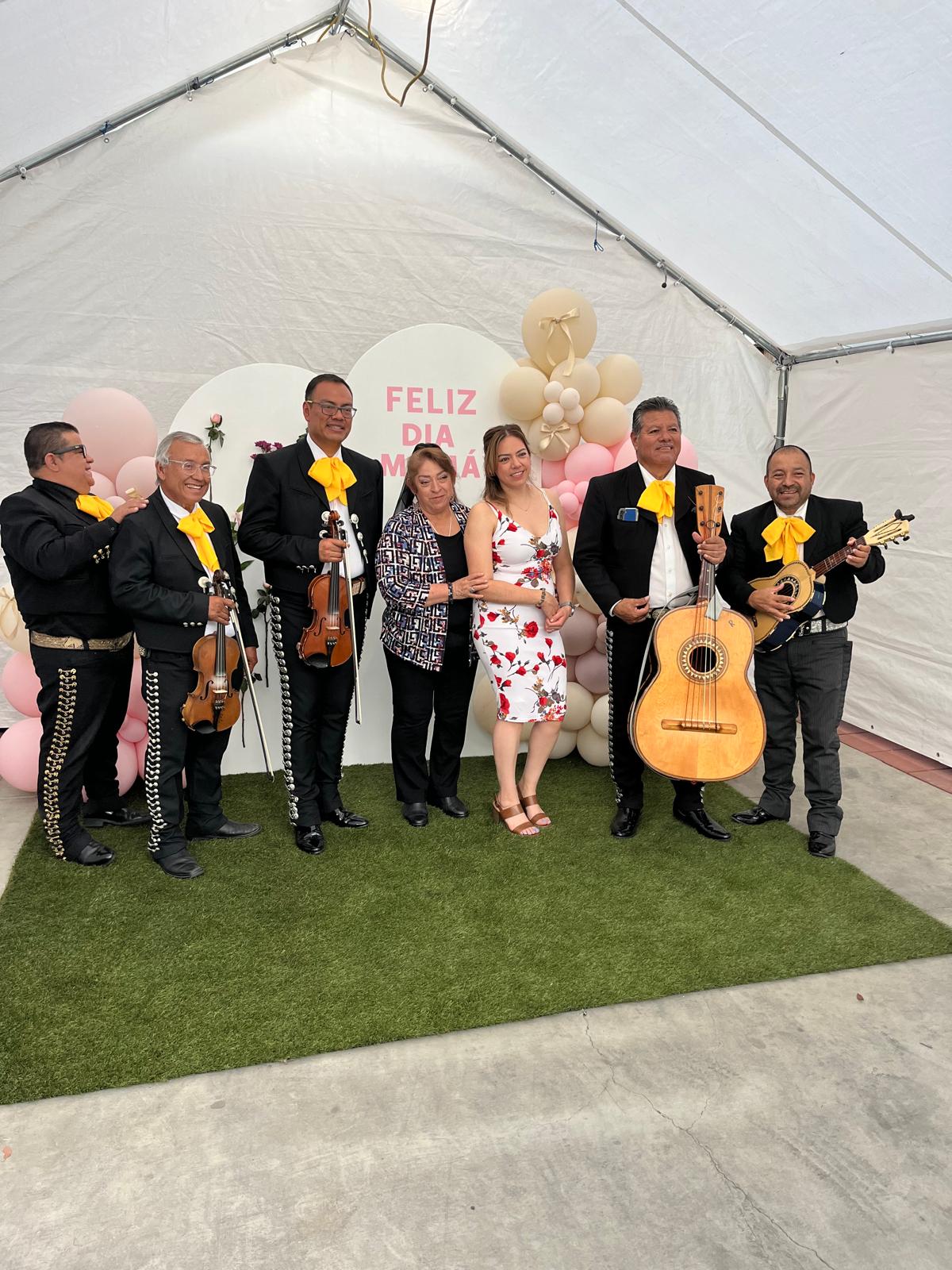 The mariachi band and a family at a Mother’s Day celebration