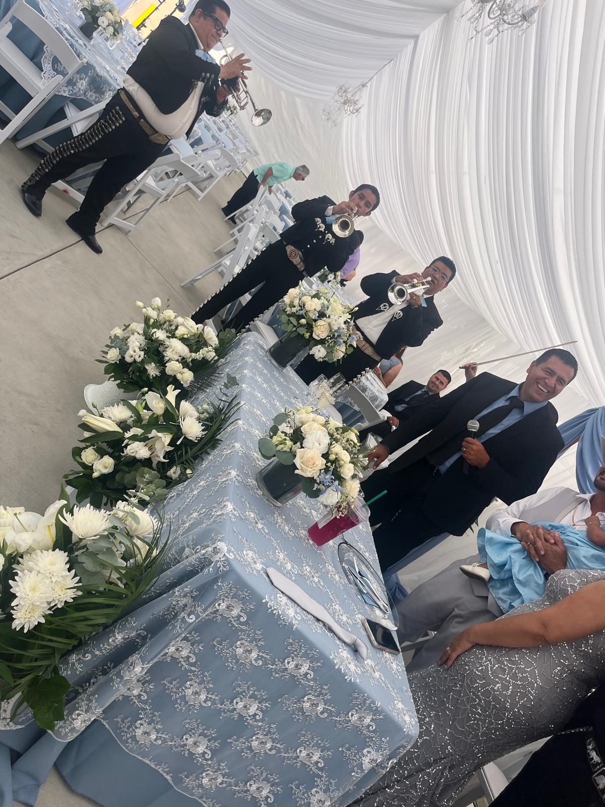 Mariachi trumpet players performing at a wedding